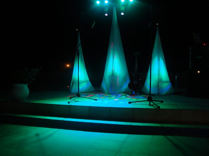 Speakers on stands with covers and uplighters and a large T b-bar with spotlights and effects Package 1 Hire Mobile